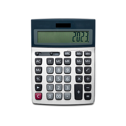 Calculator isolated on white background. Year 2023 on screen.