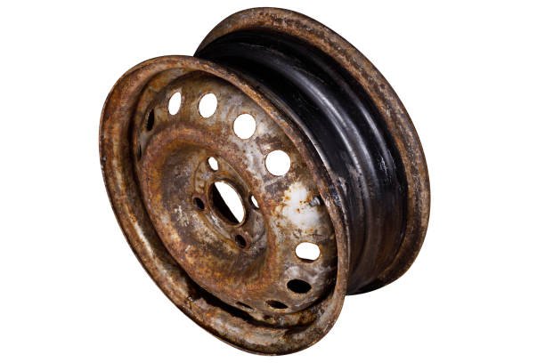 istock rusty metal car rim isolated on white background. side view 1454369885