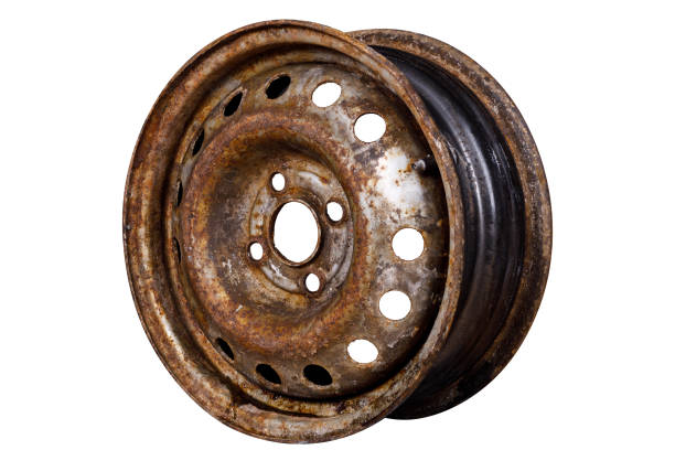 istock rusty dirty metal car rim isolated on white background. side view 1454369929