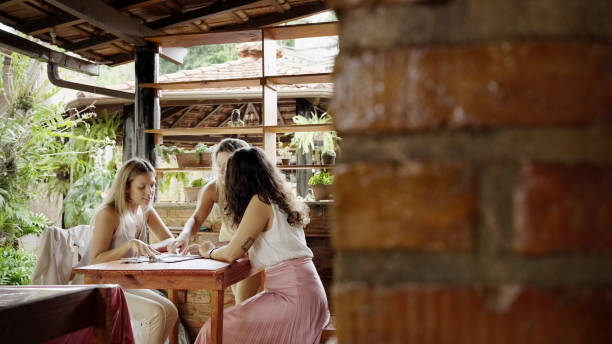 istock Group of female interior designers having meeting in creative office 1454370163