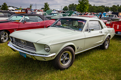 Iola, WI - July 07, 2022: High perspective front corner view of a 1968 Ford Mustang Hardtop Coupe at a local car show.