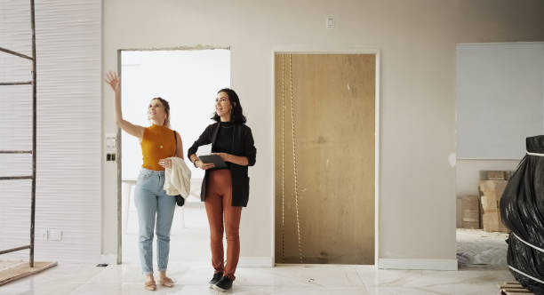 istock An architect and a client discussing interior renovation plans at construction site 1454370274