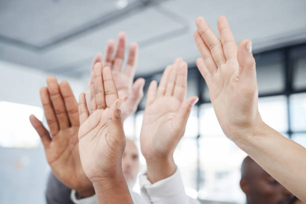 istock Support, question and teamwork with hands of business people for feedback, diversity and volunteer in office. Audience, community and goals with employee for idea, conference and vote in faq training 1454371230