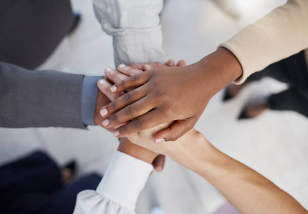 istock Hands, teamwork and collaboration of business people working in community for goal. Support, trust and group hand motivation team building circle or diversity for work vision, success or target 1454371767