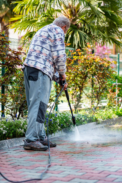 istock Senior Man at Home Cleaning the Yard with High Pressure Washer 1454374575