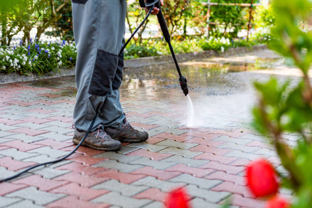 istock Senior Man at Home Cleaning the Yard with High Pressure Washer 1454374580