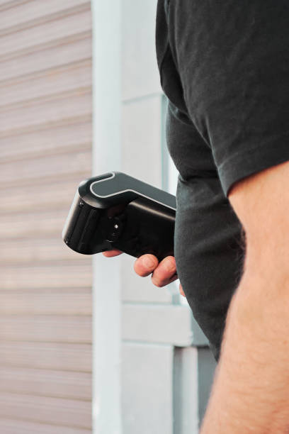 istock Selective focus on unrecognizable waiter with a payment terminal in his hand 1454376433
