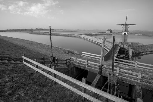 Black and white image of windmill Het Noorden, used to keep the water out of the polder on the Wadden island Texel.