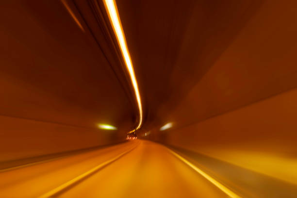 istock abstract blurred background of highway at night 1454377399