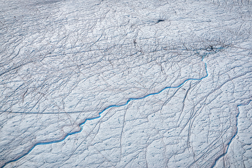 Close up of jagged blue cracks on the glacier surface of the Greenlandic inland ice cap near Ilulissat in west Greenland stock