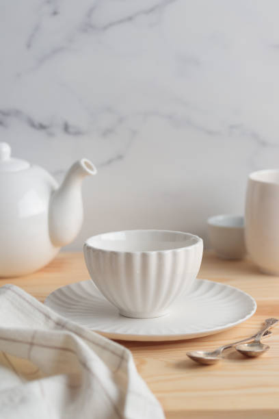 istock Empty tableware - white plate, a bowl and a cup on wooden table as a background for a dish foodbackground 1454382677