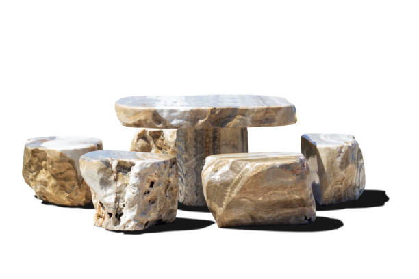 istock Set of table and chairs made from stone isolated on white background included clipping path. 1454383029