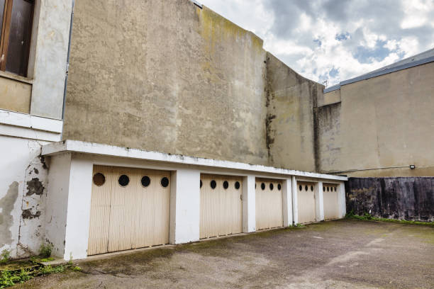 istock courtyard with old garages surrounded by run down buildings 1454384377