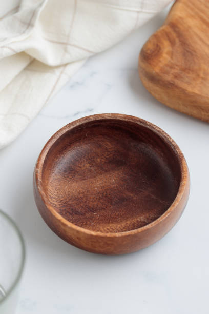 istock Empty tableware - wooden plate, a bowl and a cup on white table as a background for a dish foodbackground 1454385311