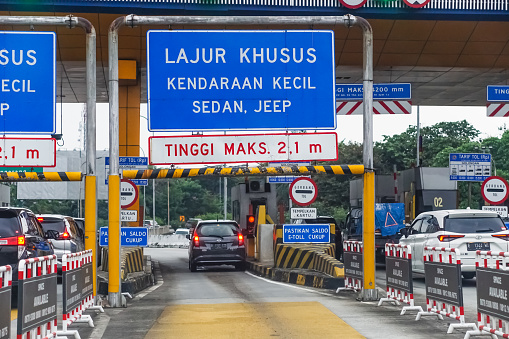 Tangerang, Indonesia - December 30, 2022: Toll gates as a place to pay for services when using the freeway.