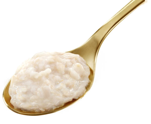 istock Baby cereal on golden spoon 1454390257