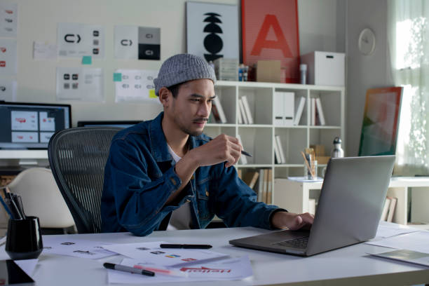 istock Asian man Graphic designer working in office. 1454390757
