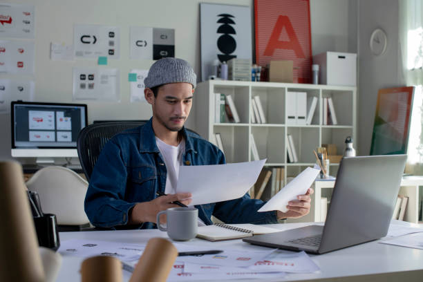 istock Asian man Graphic designer working in office. 1454390762