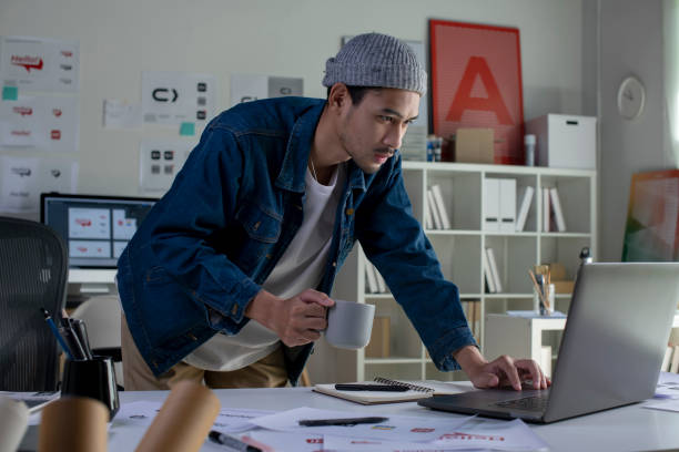 istock Asian man Graphic designer working in office. 1454390781