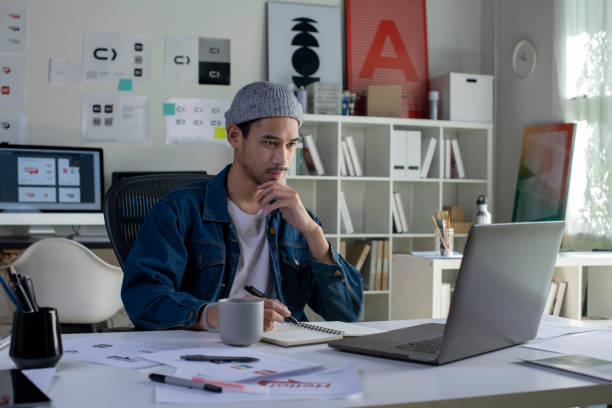 istock Asian man Graphic designer working in office. 1454390786