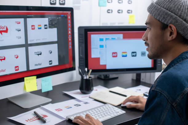 istock Young Asian man graphic designer working in his studio office. 1454390850