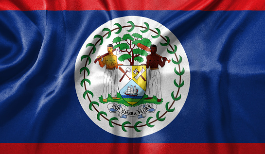 Belize flag wave close up. Full page Belize flying flag. Highly detailed realistic 3D rendering.