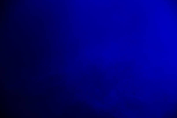 istock Dark blue smoky light scene illumination. Blue mystical background with smoke. 1454396227