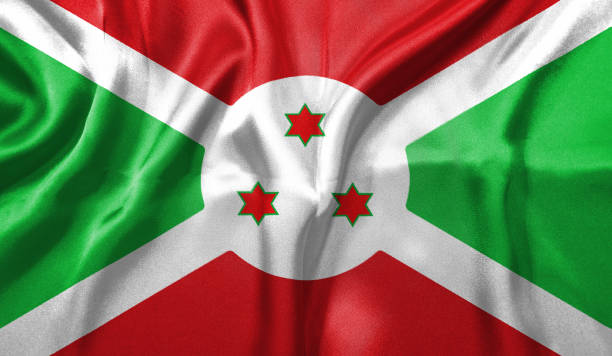 Burundi flag wave close up. Full page Burundi flying flag. Highly detailed realistic 3D rendering.