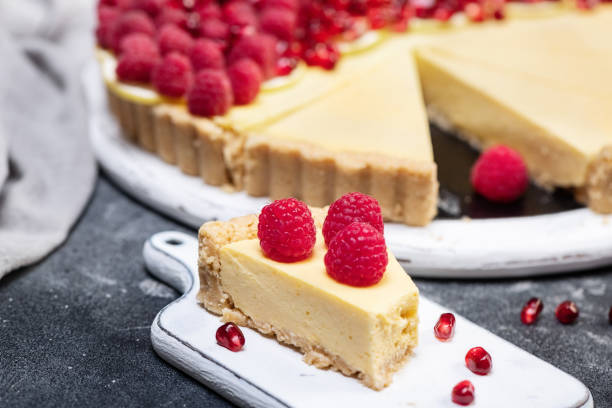 istock fresh french tart with raspberries on dark background 1454396545