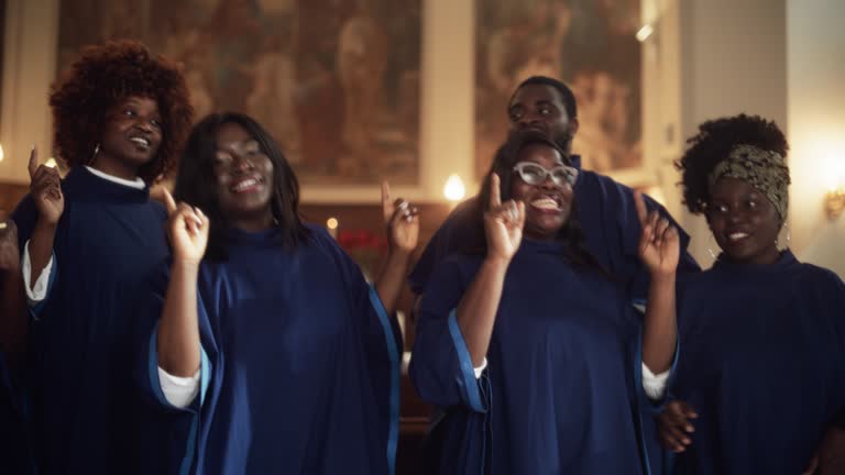 Group Of Christian Gospel Singers Praising Lord Jesus Christ. Song Spreads Blessing, Harmony in Joy and Faith. Church is Filled with Spiritual Message Uplifting Hearts. Music Brings Peace, Hope, Love