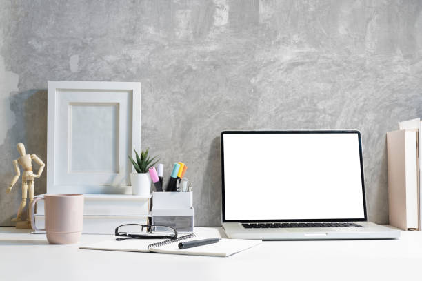 istock Stylish workplace with laptop computer, coffee cup, stationery and picture frame. 1454401450