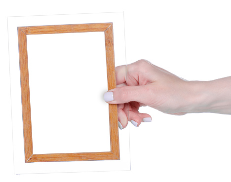 Empty photo frame in hand on white background isolation