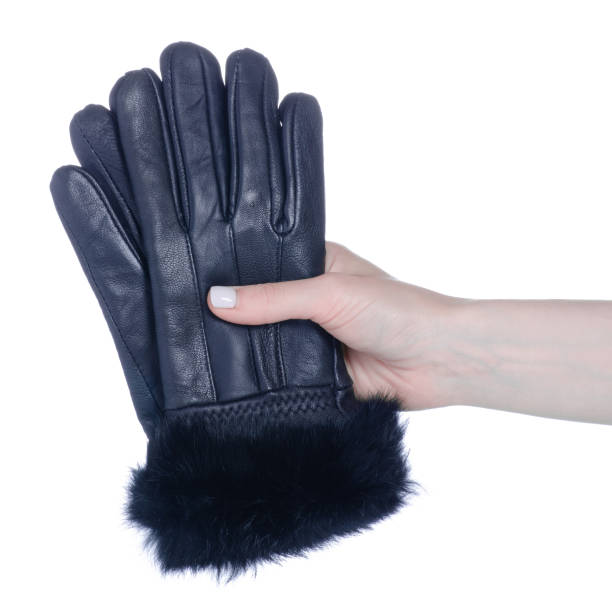 istock Black leather gloves in female hand 1454402763