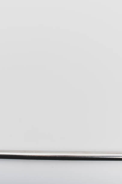 istock shiny metal tube close up on a white background with space for text 1454406731