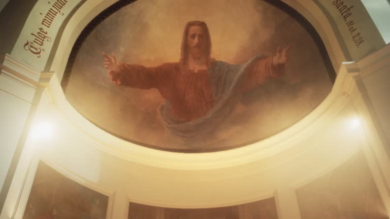 In Grand Old Church at the Altar Ministers Lead The Eucharist, Sacred Christian Ceremony. Holy Communion, Divine Mass, Lord's Supper. Pan Camera Movement Showing Painting of Jesus Christ on Ceiling