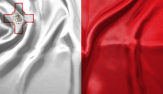 Malta flag wave close up. Full page Malta flying flag. Highly detailed realistic 3D rendering.