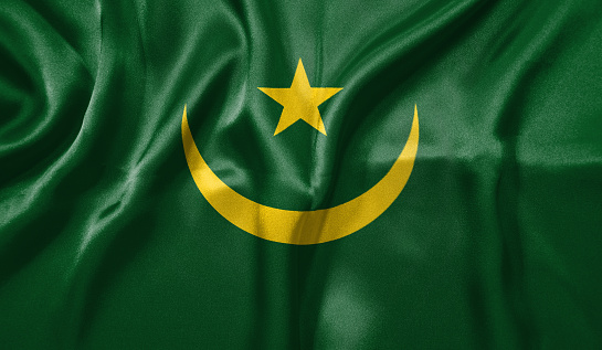 Mauritania flag wave close up. Full page Mauritania flying flag. Highly detailed realistic 3D rendering.