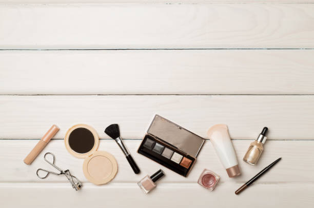 istock Different makeup products on wooden background, top view 1454410478