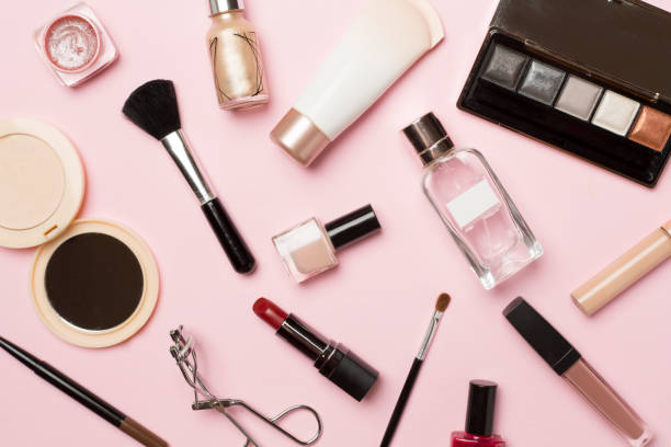 istock Different makeup products on color background, top view 1454410486