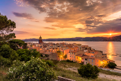 Scenic view of Saint Tropez in summer sunset light and city lights turned on