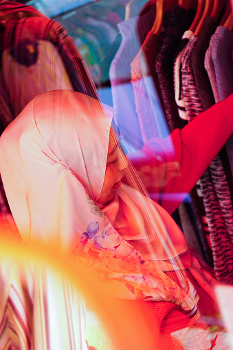 Portrait of Young asian muslim woman shopping in a fashion store