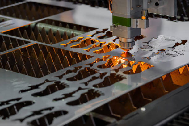 istock Laser cutting machine working with sheet metal with sparks 1454412749