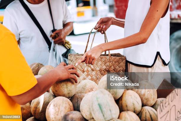 A Filipino Street Vendor Selling Fresh Melons Stock Photo - Download Image Now - Makati, Adult, Adults Only