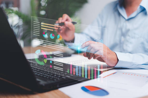 istock Businessman use laptops to work on smart digital marketing analysis and data management, Business strategy concept, Graph and marketing data Digital show on virtual screen and business management 1454412938