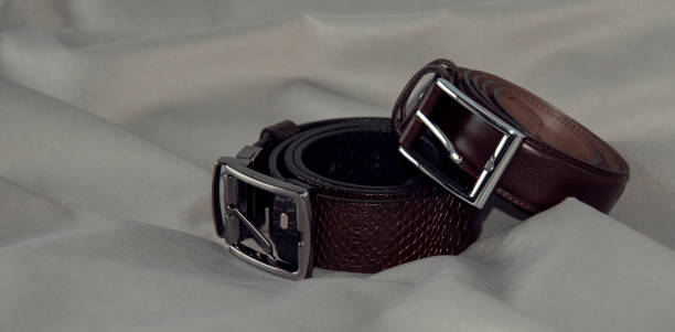 istock Men's branded belts in black and brown 1454414664