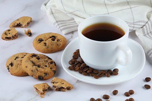 Cup of coffee and chocolate cookies. Isolated on white. RELATED IMAGES: