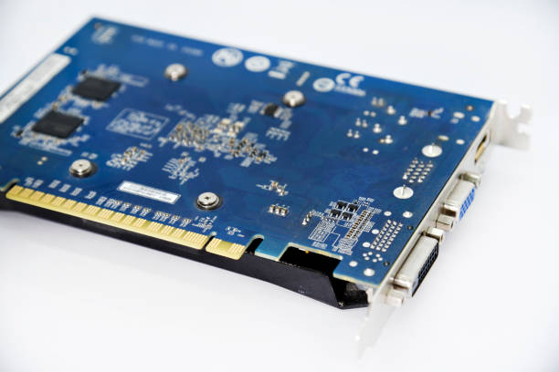 istock Electronic graphics card board with chips and radio elements. The reverse side of the video card. Transistors and capacitors. 1454417263
