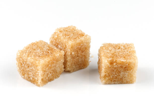 istock Three pieces of brown sugar isolate. Cane sugar. 1454417567