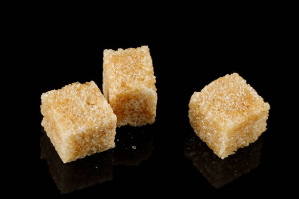 istock Three pieces of brown sugar isolate. Cane sugar. 1454417569
