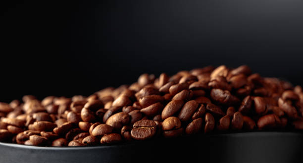 istock Coffee beans on a black background. 1454419120